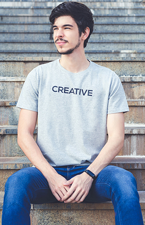 man seating in creative print shirt